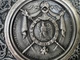 a metal plaque with a picture of an angel on it