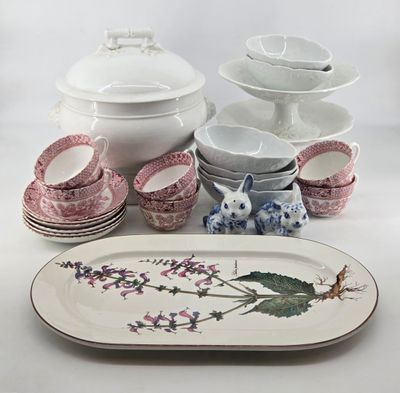 a lot of plates and bowls that are on the table