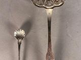 two spoons and a spoon with a flower on them