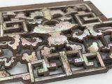 a picture of a decorative piece on a white surface