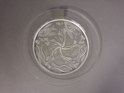 a glass plate with a design on it on a table