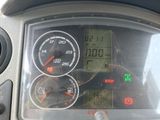 a close up of a car dashboard with various gauges