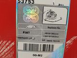 a red box with a sticker on it and a sticker on the side of it