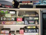 many board games on a shelf in a room