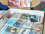 a box full of books and magazines sitting on the floor