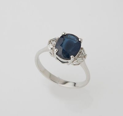 an oval sapphire and diamond ring