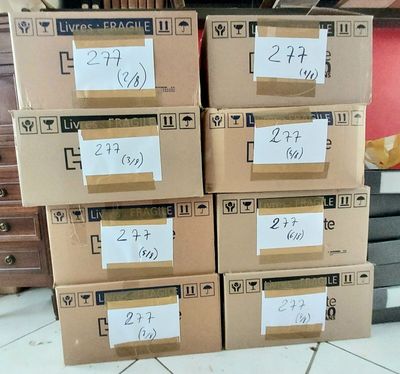 several boxes stacked on top of each other on a tiled floor