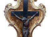 une statue de jésus en croix sur le mur
