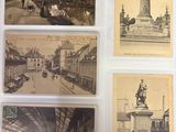 several old postcards of a city with a statue in the middle