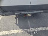 a close up of a car ' s rear end with a broken bumper