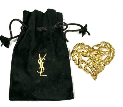 black velvet pouch with a gold heart brooch and a black velvet bag with a gold heart brooch