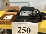 a bag of electronics on a table with a price tag