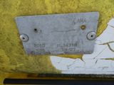 a close up of a sign on a yellow wall