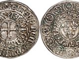 a silver coin with an image of a man on it