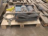 a box with a bunch of wires sitting on a pallet