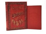 un vieux livre à la couverture rouge posé sur une surface blanche