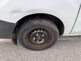 a white van that has a flat tire on it