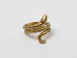 an image of a gold snake ring on a white background