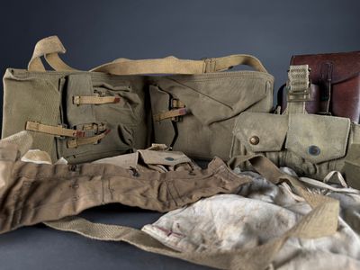 several pieces of military clothing are laid out on a table
