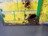a picture of a yellow and green box with a hole in it