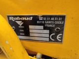 the label on the back of a yellow tractor is clearly visible