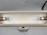 a metal box with two light bulbs inside of it