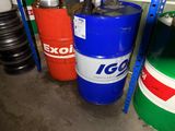 many barrels of different colors and sizes in a room