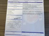 a document with a picture of a plane on it sitting on a table