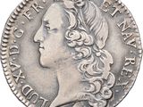 a close up of a coin with a woman ' s face on it