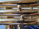 a close up of a brass instrument with a number on it
