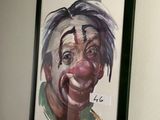une photo d'un tableau représentant un clown accroché au mur