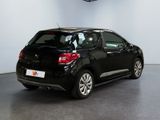 the back of a black citrole parked in a showroom