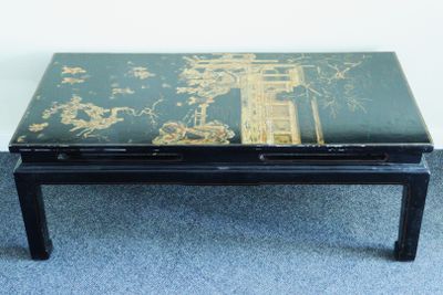 a black table with a green and gold design on it