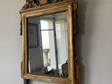 a mirror hanging on the wall in a room