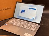 a laptop that is sitting on a table next to a box