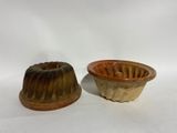 pair of ceramic molds of a bundt cake and a chocolate cake