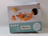 a box that has a toy duck and ducklings in it