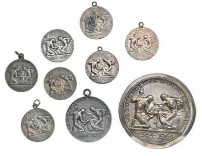 several ancient silver coins are shown on a white surface