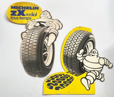 two stickers of a cartoon character on a car tire