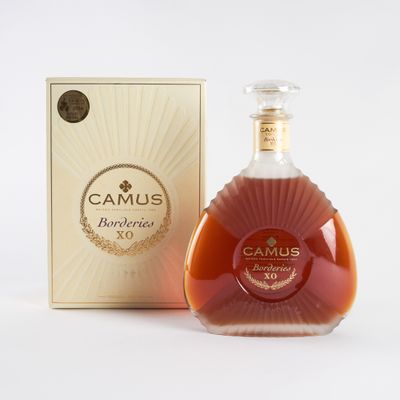 an image of a bottle of camus brandy next to a box