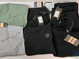 four pairs of men ' s pants with tags on them