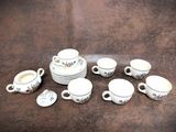 a lot of cups and saucers on the table