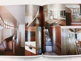 an open book with a picture of a house inside of it