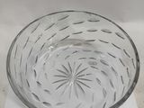 an empty glass bowl sitting on top of a piece of paper