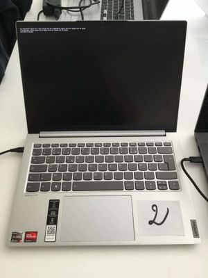 two laptops that are sitting on a table