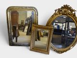 two mirrors sitting next to each other on a table