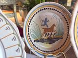 many plates that are sitting on a table