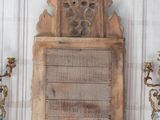 three vases and a plaque on a mantle