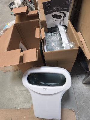 a toilet that is sitting on the ground next to a box