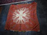 a large red and white rug on the floor